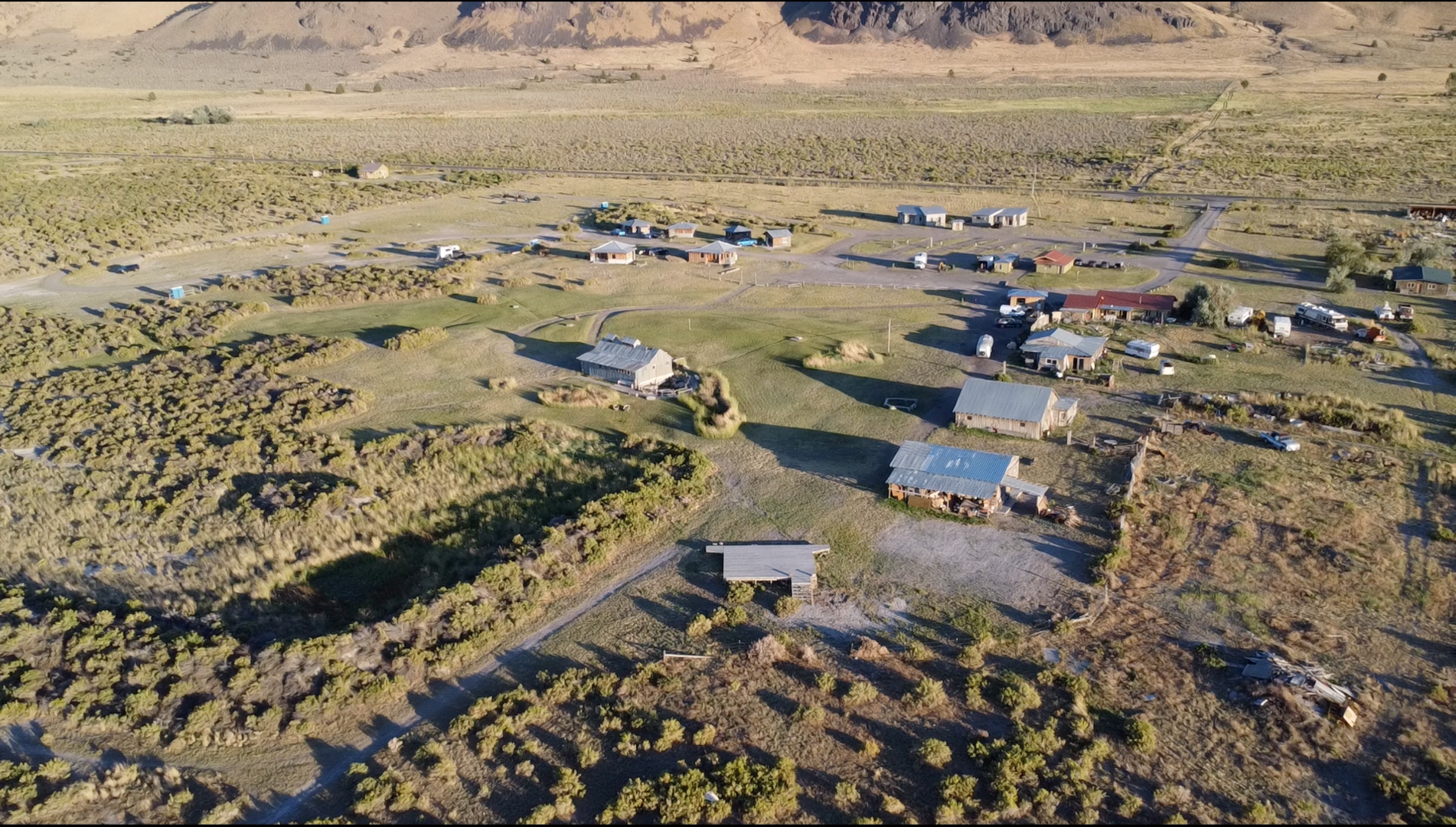 Aerial drone view of Summer Lake Hot Springs property at golden hour