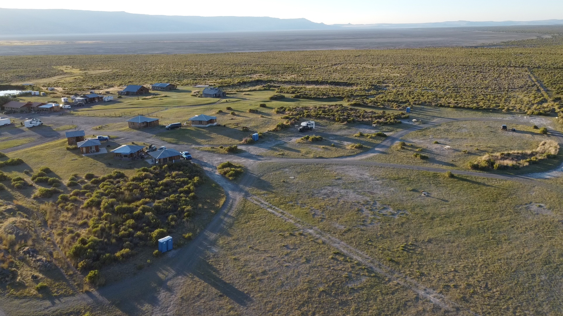Aerial drone view of Summer Lake Hot Springs campground and open desert